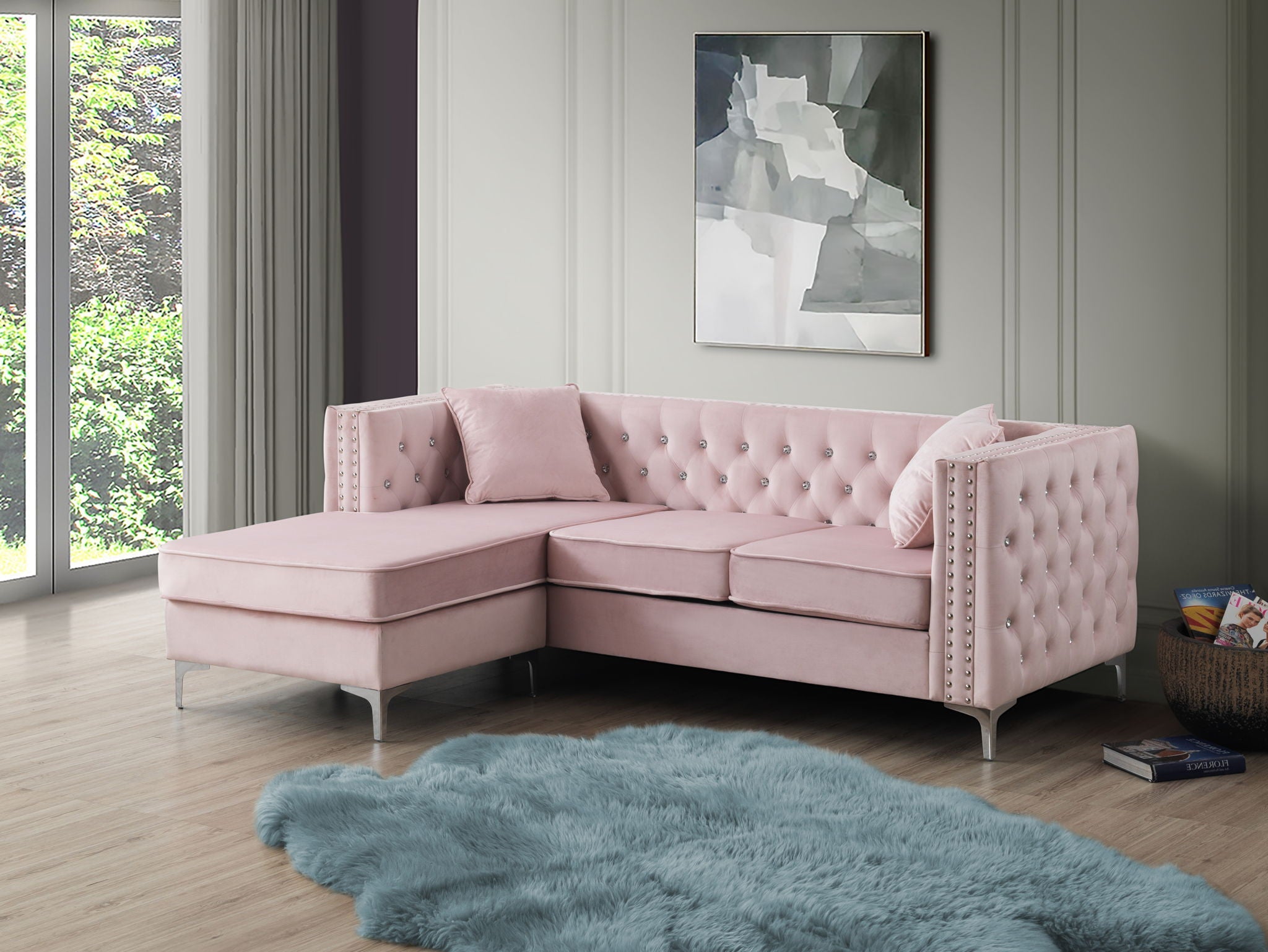 Blush pink velvet sofa chaise with crystal tufting and nailhead trim, styled in a modern living room