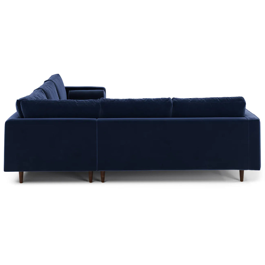 Back view of the navy velvet Simone Sectional showing clean tailored lines and tapered legs