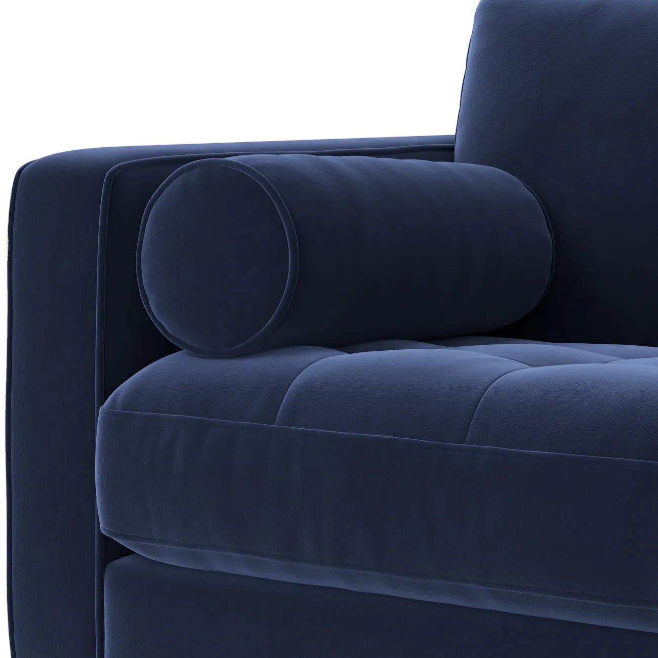 Close-up of navy velvet bolster pillow and tufted seat corner on the Simone Sectiona