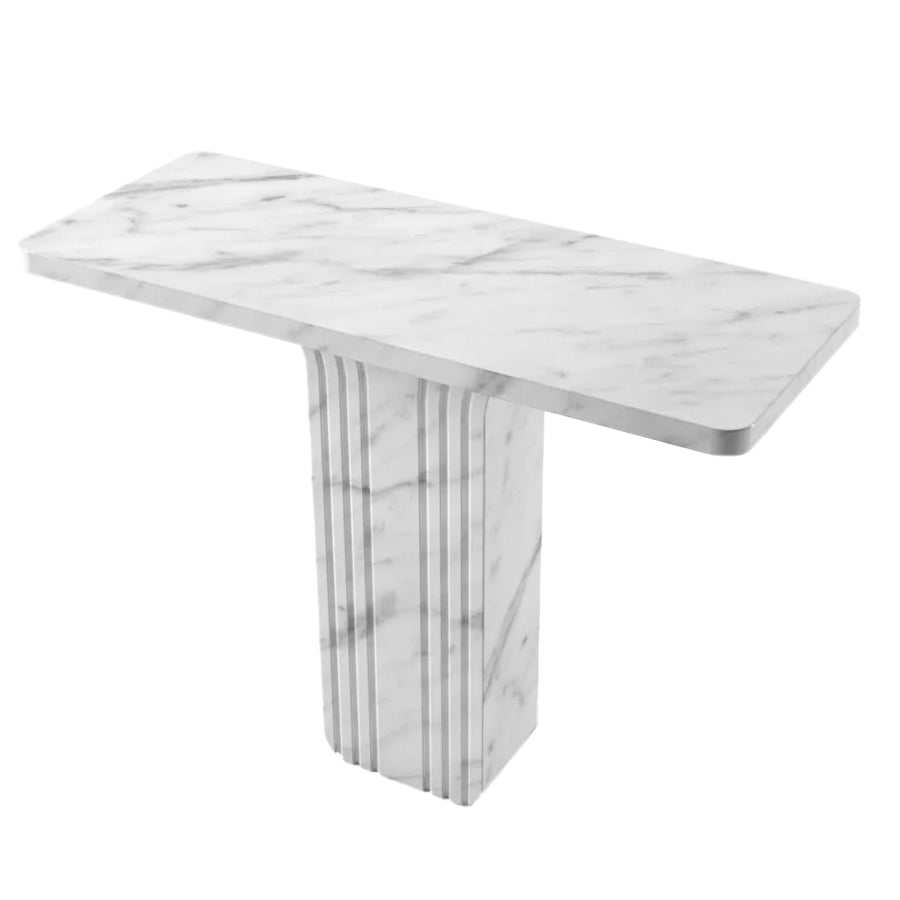 Angled view of Carrara marble console table showing tabletop veining and reeded pedestal