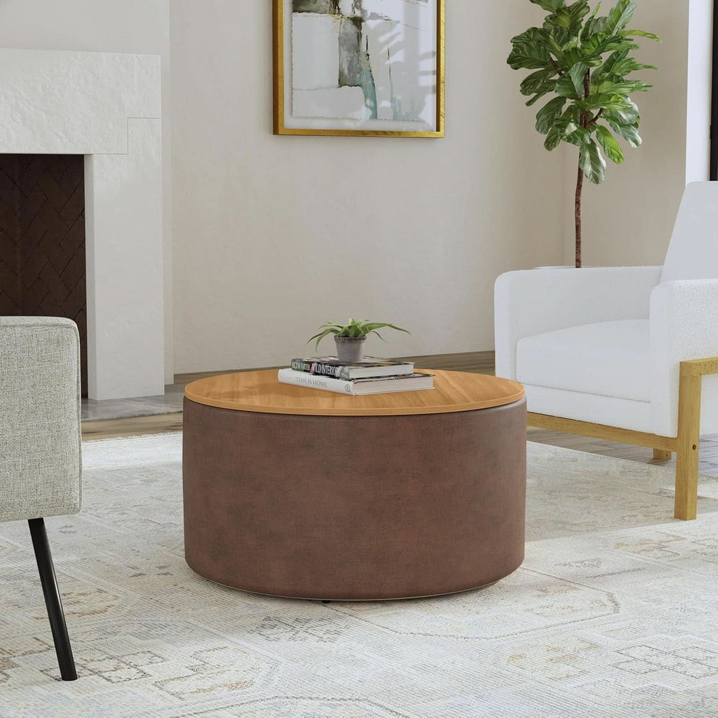 Editorial three-quarter view of the Element storage ottoman styled in a bright, modern living room on a neutral patterned rug, flanked by low-profile accent chairs.