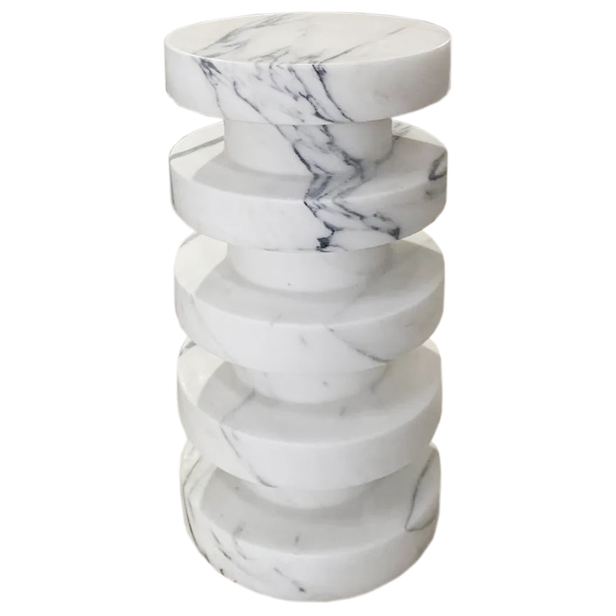 Front view of stacked marble disc side table showing natural veining across each tier