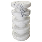 Front view of stacked marble disc side table showing natural veining across each tier