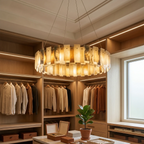 Round tiered alabaster chandelier hanging above a breakfast nook dining table