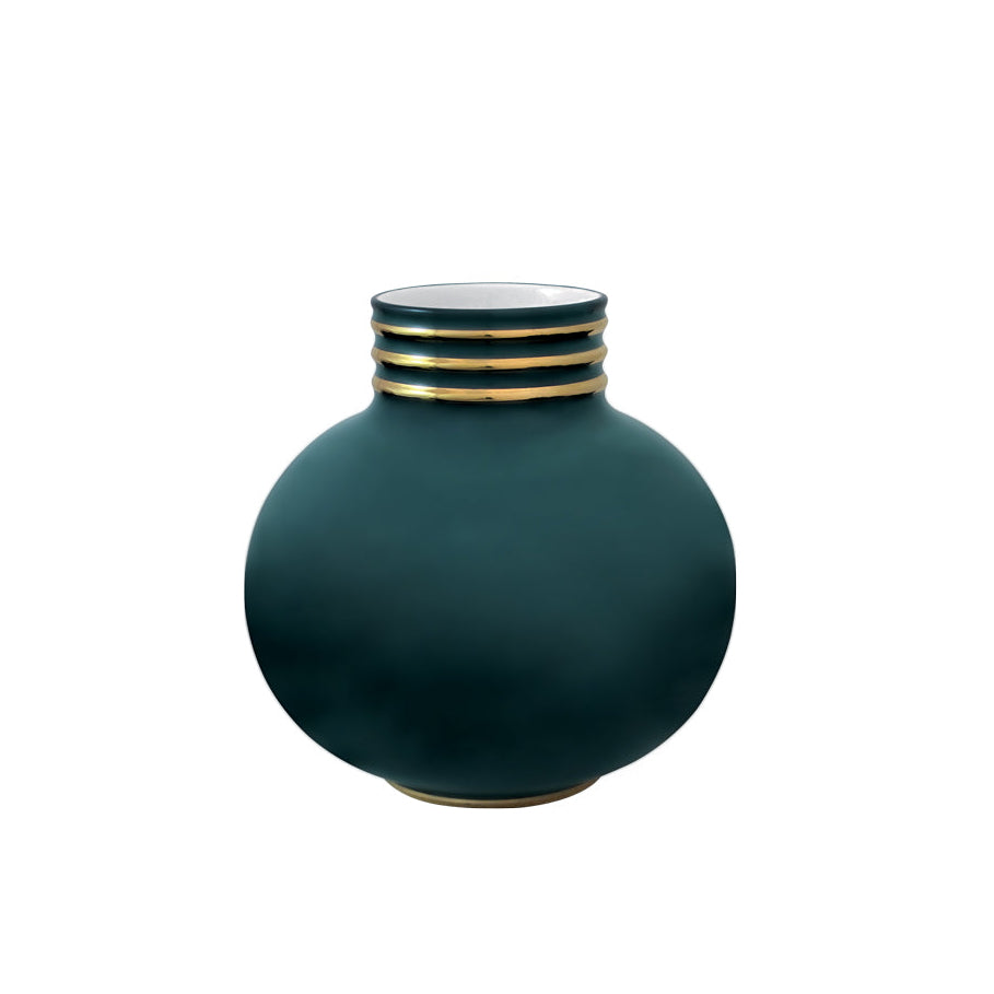 Round peacock green porcelain vase with a gold-banded neck, displayed on a wood console against a neutral gray backdrop