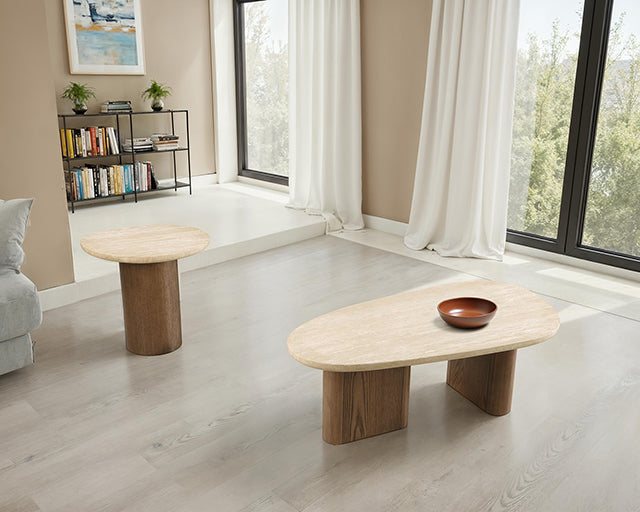 Travertine side table and organic-shaped coffee table with matching oak bases styled together in a living room