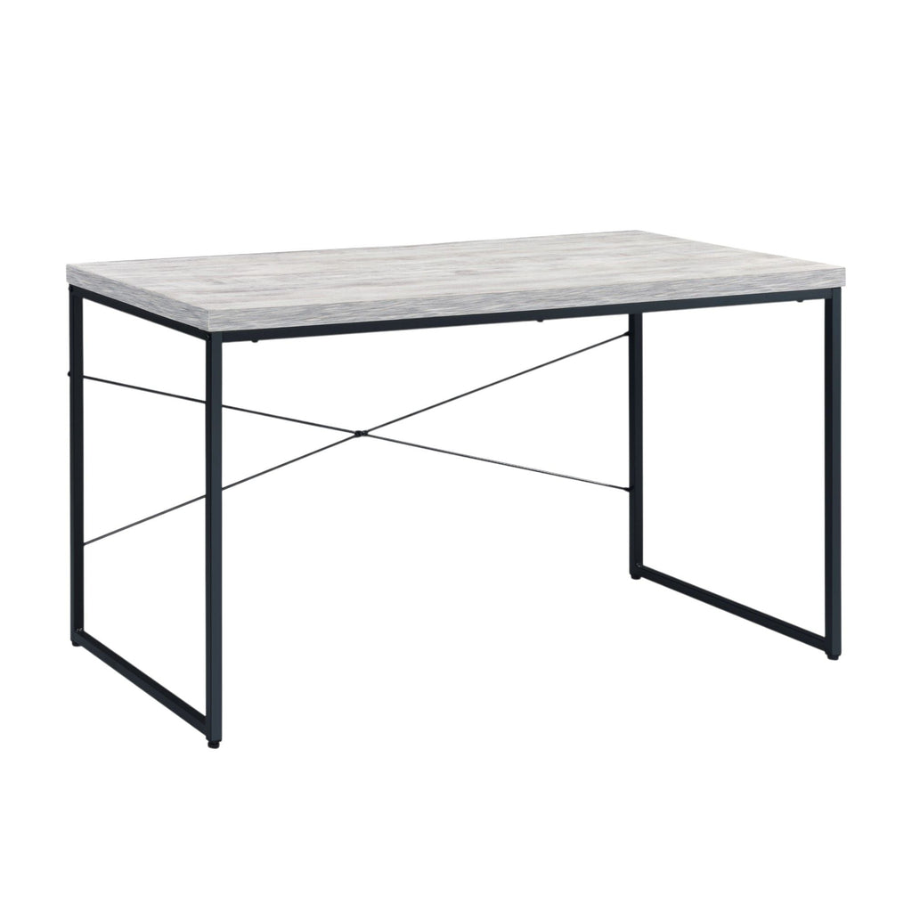 Weathered oak writing desk with open black iron X-brace frame on a white background