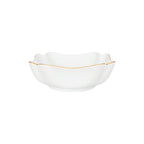 Square porcelain bowl with soft scalloped corners and a fine gold rim, shown against a white background