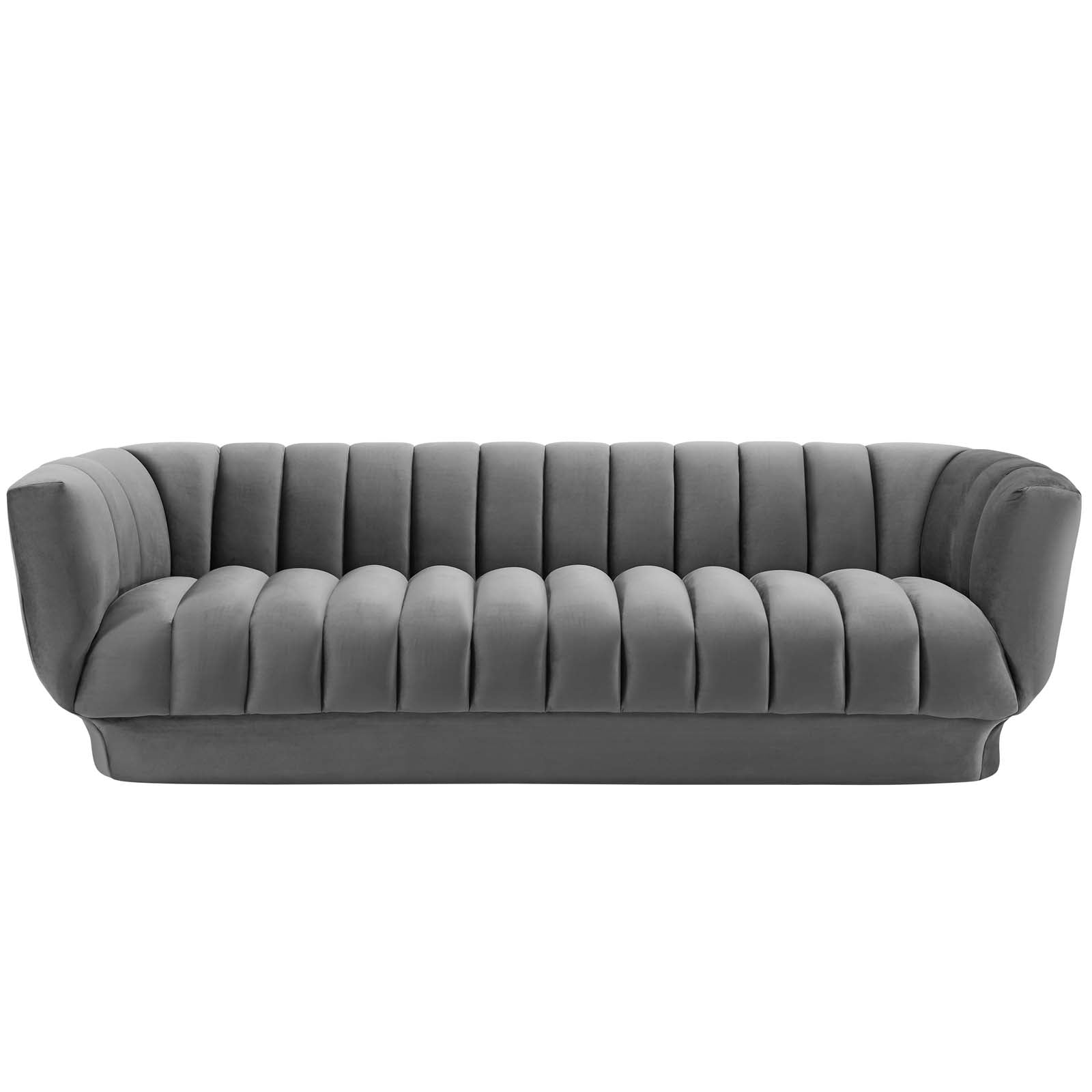 Studio front view of the Cannelé Sofa showing the precise symmetry, continuous channel tufts, and integrated velvet rimmed base.