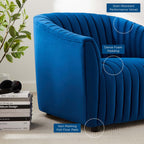 Close-up vignette of the Cobalt Voûte Armchair in navy velvet, highlighting the tight vertical channel tufting, dense padding, and low felt-padded feet.