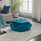 Teal velvet faceted storage ottoman styled on a rug beside a beige armchair and potted plant