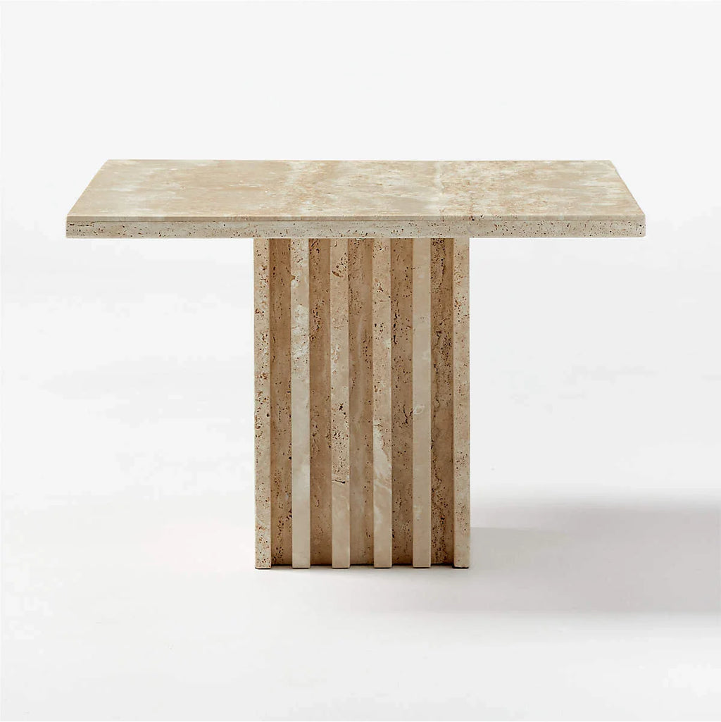 Honed travertine side table with fluted column base shown from a front angle on a white background