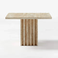 Honed travertine side table with fluted column base shown from a front angle on a white background