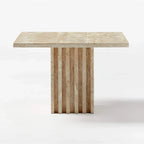 Honed travertine side table with fluted column base shown from a front angle on a white background