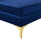 Close-up of the navy velvet cushion corner and gold metal leg detailing