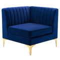 Navy channel-tufted velvet corner chair with gold metal legs, shown against a white background