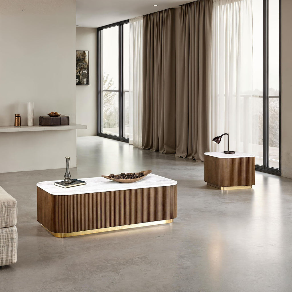 Marble and reeded walnut cocktail table and end table styled together in a modern living room