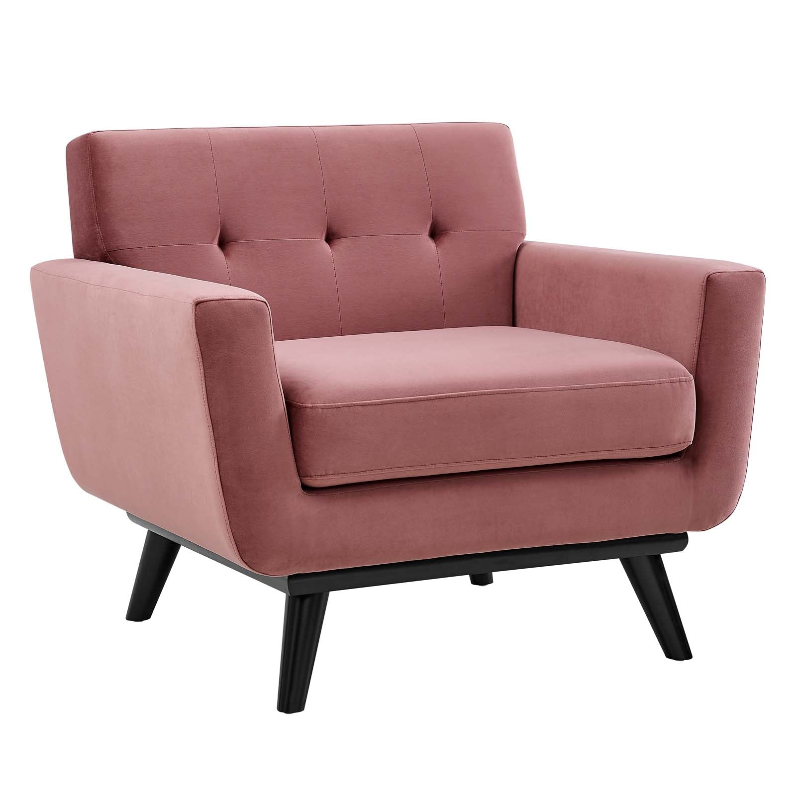 Dusty rose velvet tufted armchair with black wood splayed legs, shown at a front angle