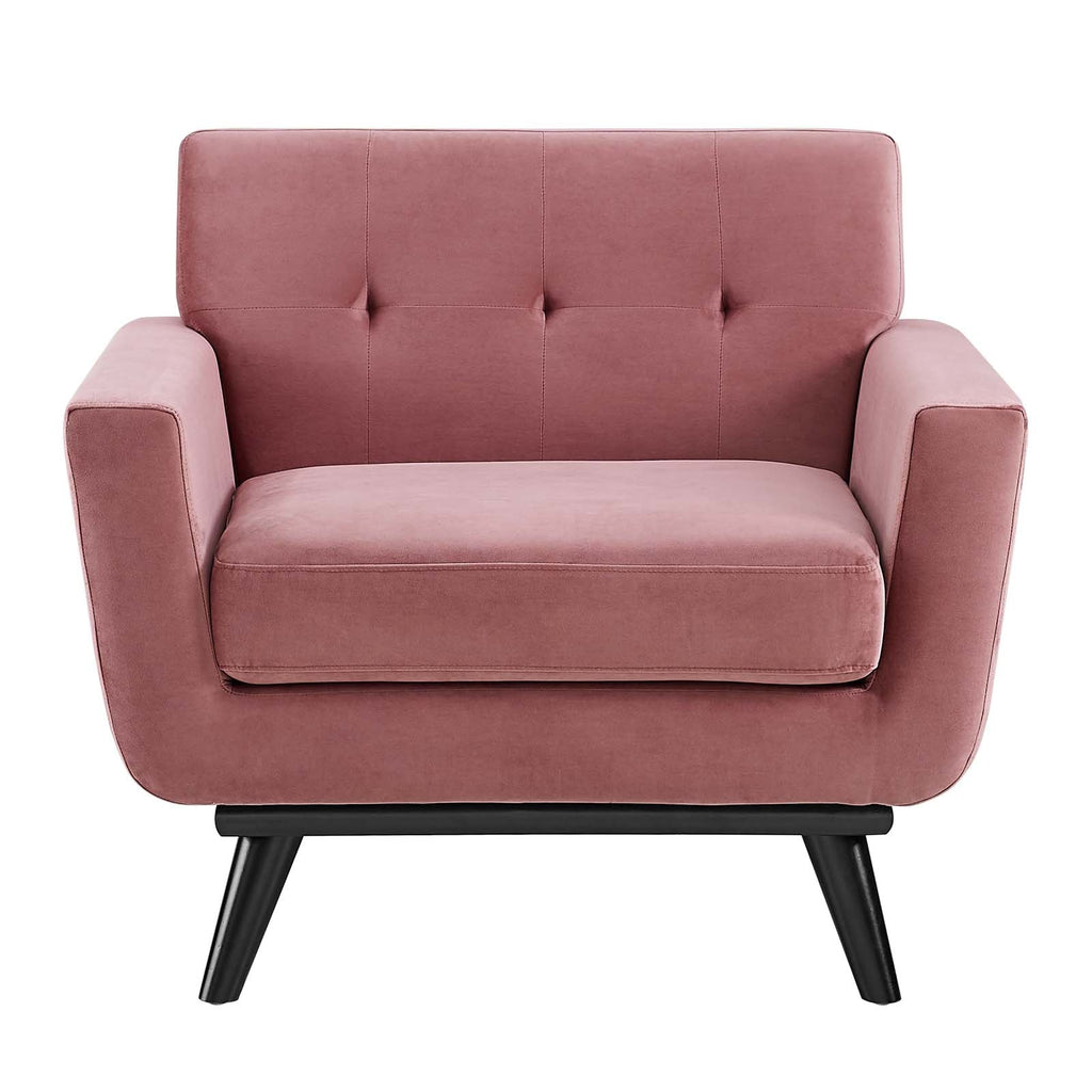 Straight-on front view of the Camille Armchair showing tufted backrest and black wood legs