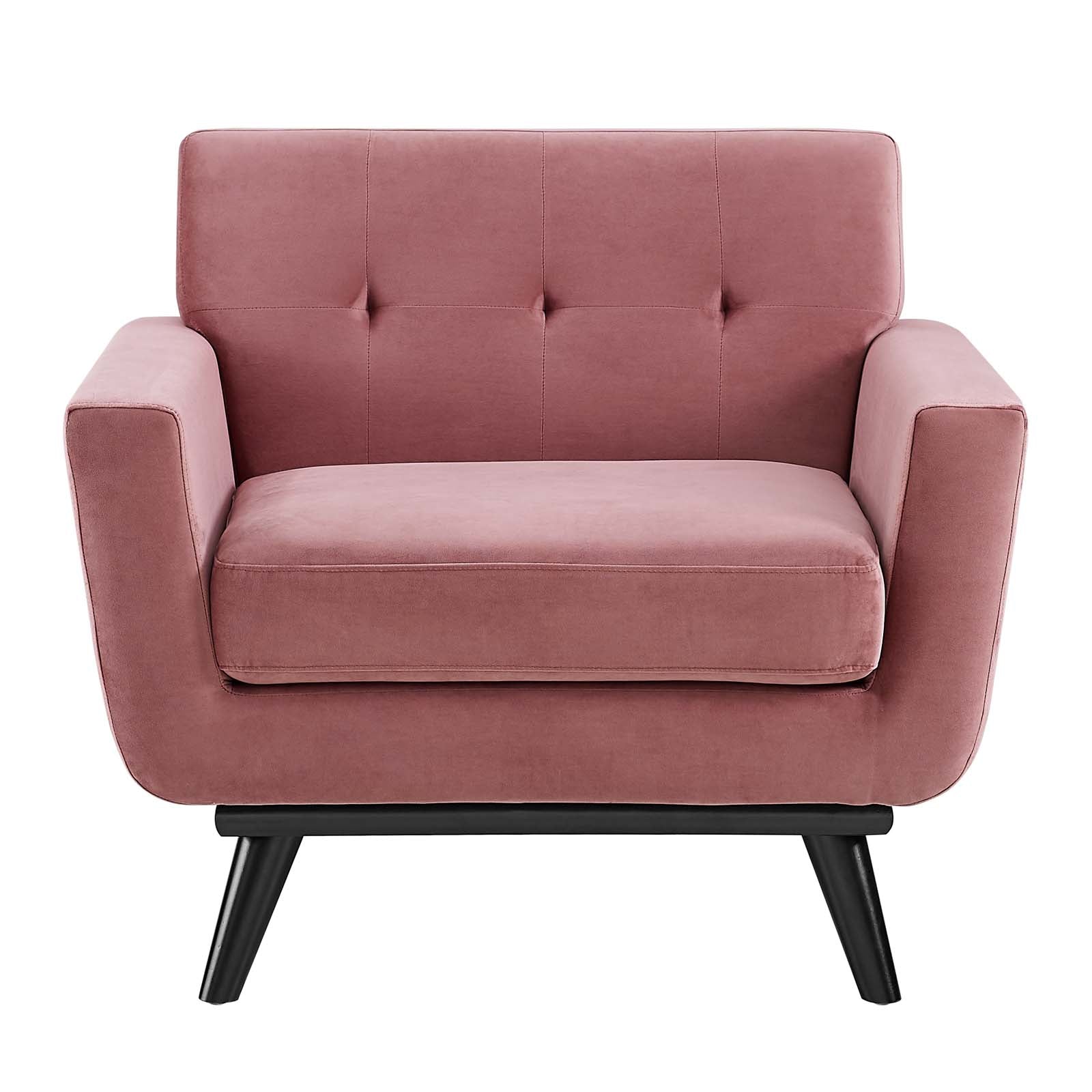 Straight-on front view of the Camille Armchair showing tufted backrest and black wood legs