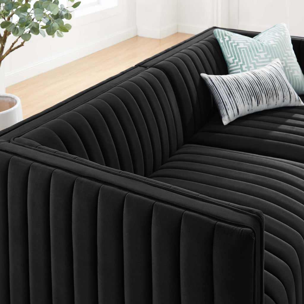 Close-up of continuous vertical channel tufting on the Marceau Loveseat with patterned throw pillows