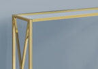 Close-up of the gold metal frame and glass top corner joinery on the console table