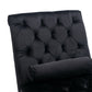 Close-up of deep diamond button-tufted black velvet with a bolster pillow on the Rochelle Chaise