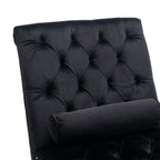 Close-up of deep diamond button-tufted black velvet with a bolster pillow on the Rochelle Chaise