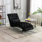 Black velvet Rochelle chaise lounge with acrylic feet styled in a neutral living room beside a marble side table