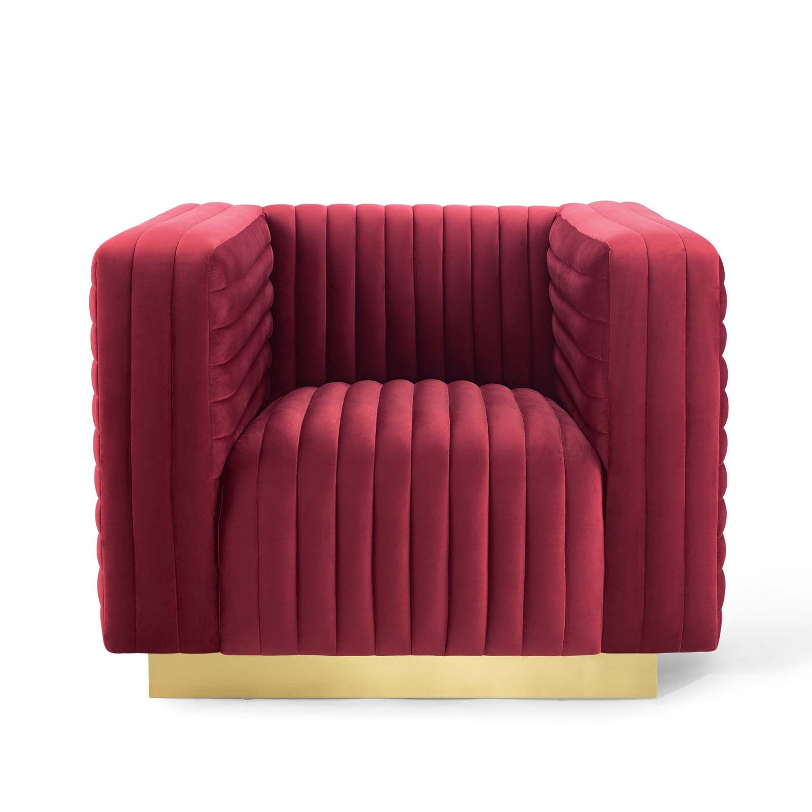 Symmetrical front orthographic view of the architectural maroon velvet Rubis Bloc Armchair showcasing its crisp tuxedo frame and recessed gold base.