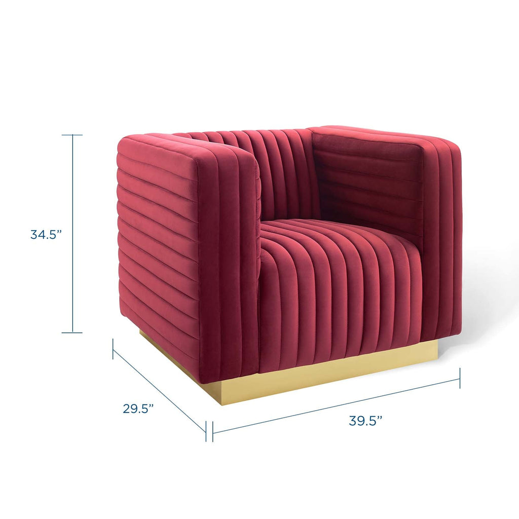Three-quarter studio profile of the maroon velvet Rubis Bloc Armchair with clear geometric dimension annotations and a gold plinth base.