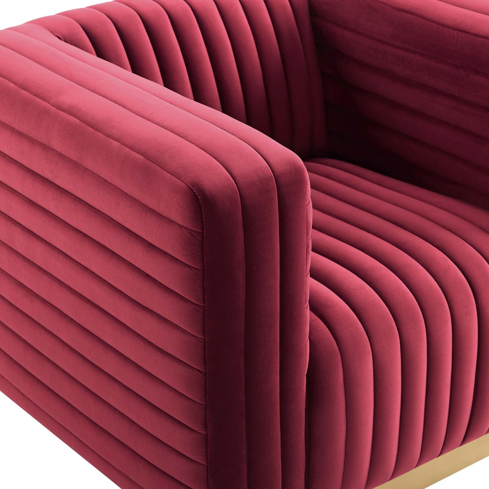 Macro texture shot showcasing the intersection of vertical and horizontal channel tufting on the taut maroon performance velvet armchair armrest.