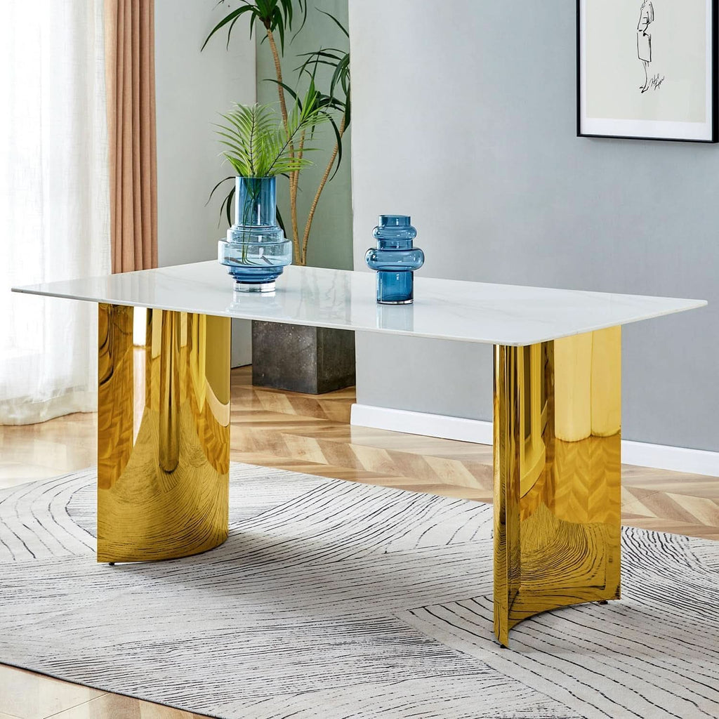 White marble glass-veined dining table with sculptural gold column base, styled with blue glass vases