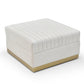 Ivory velvet channel-tufted ottoman with brushed gold base shown from a high angle on a white background