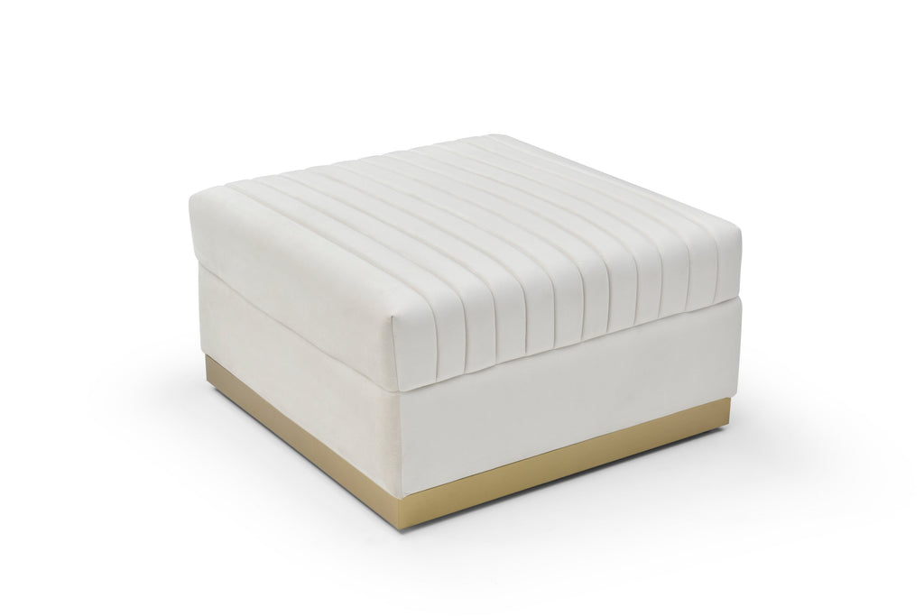 Ivory velvet channel-tufted ottoman with brushed gold base shown from a high angle on a white background