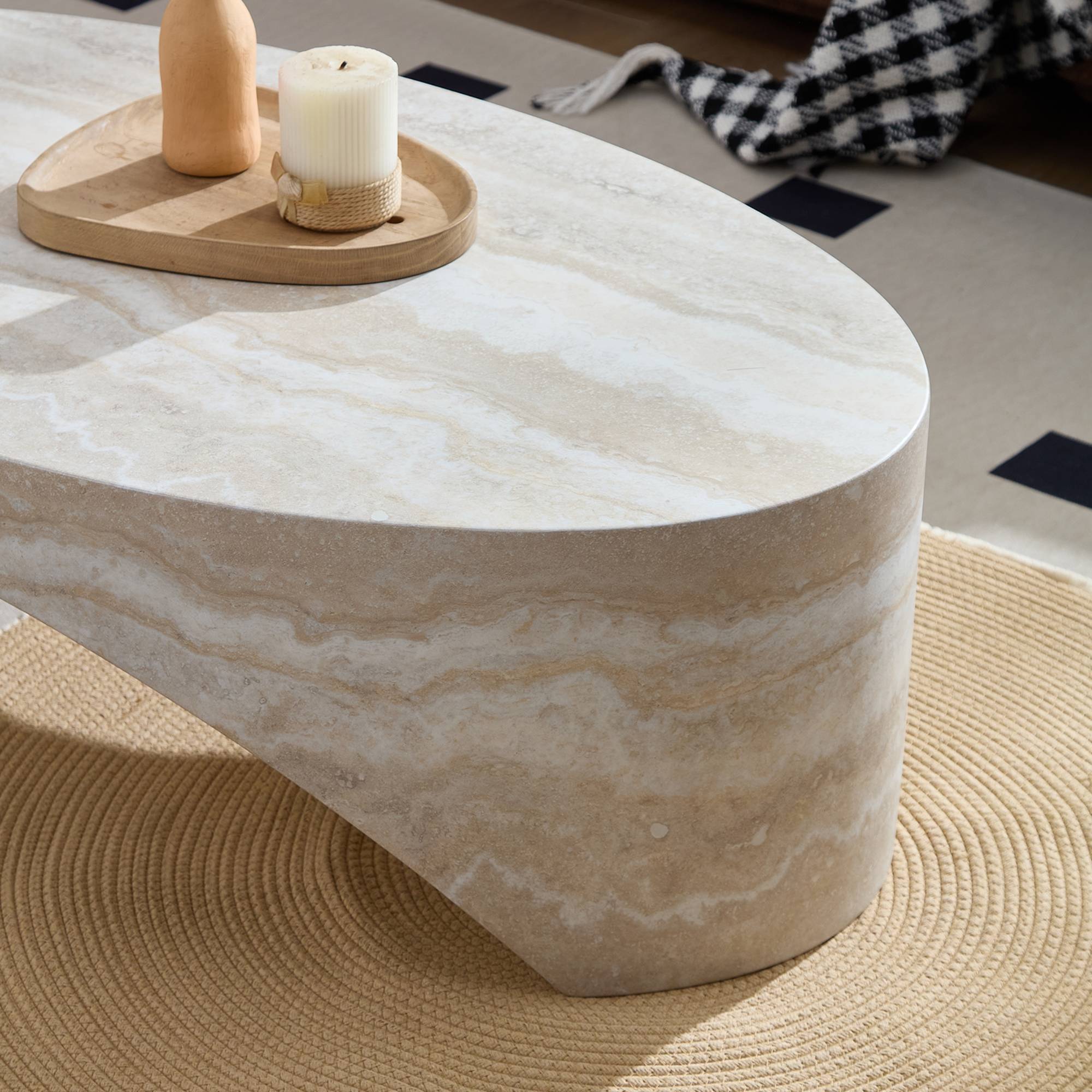 Macro close-up shot highlighting the smooth curved corner and detailed cream-and-white stone veining finish of the fiberglass coffee table.
