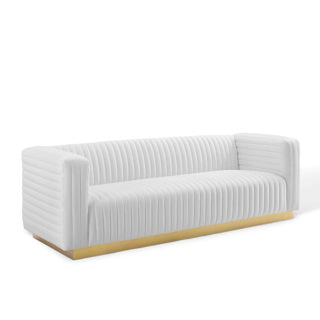 Ivory channel-tufted velvet sofa with continuous vertical ridges and solid gold base
