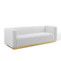 Ivory channel-tufted velvet sofa with continuous vertical ridges and solid gold base