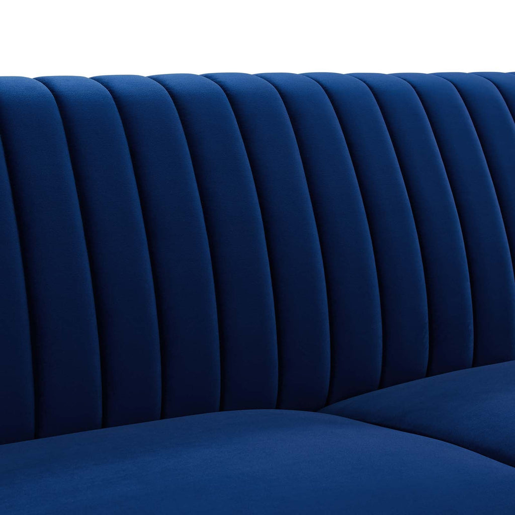 Close-up of vertical channel tufting detail on the Winsome Sofa's navy velvet backrest