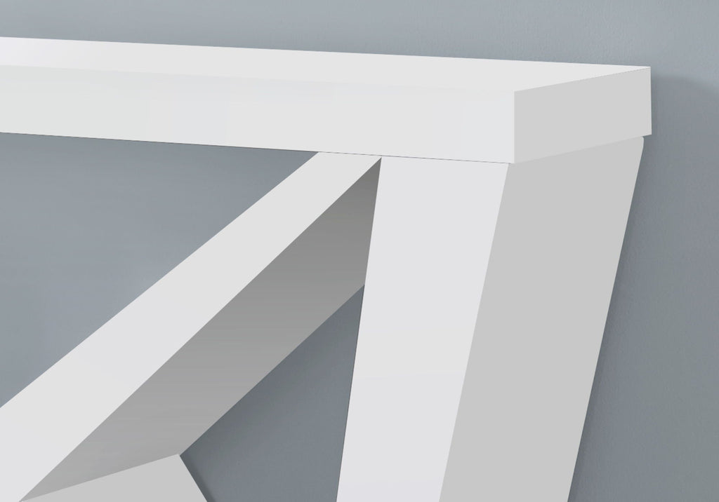 Close-up of white console table corner showing wedge leg construction and tabletop thickness