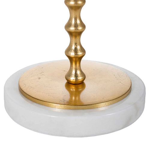 Close view of the Adèle Table Lamp base showing white marble beneath a warm-gold circular plate and segmented metal stem.