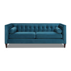 Symmetrical straight-on studio view of the Cadence 84-inch tuxedo sofa in teal blue velvet, highlighting its flat-surface lower frame and integrated bolster inserts against a clean white backdrop.