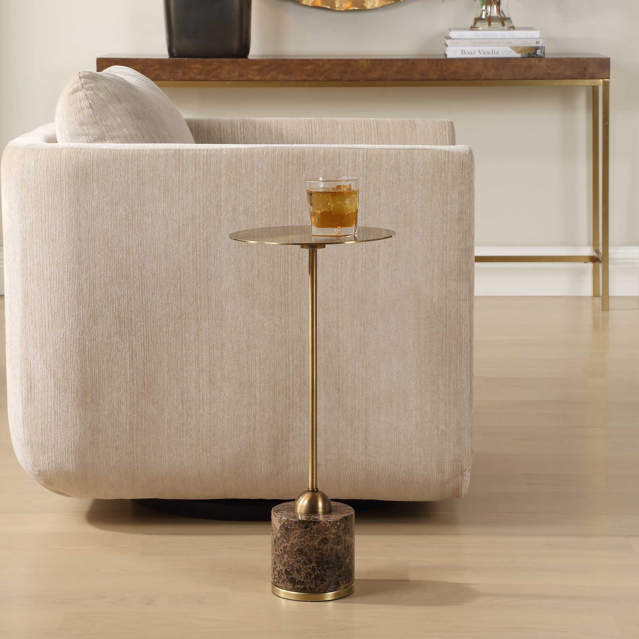 The Isabeau Drink Table beside a curved upholstered chair