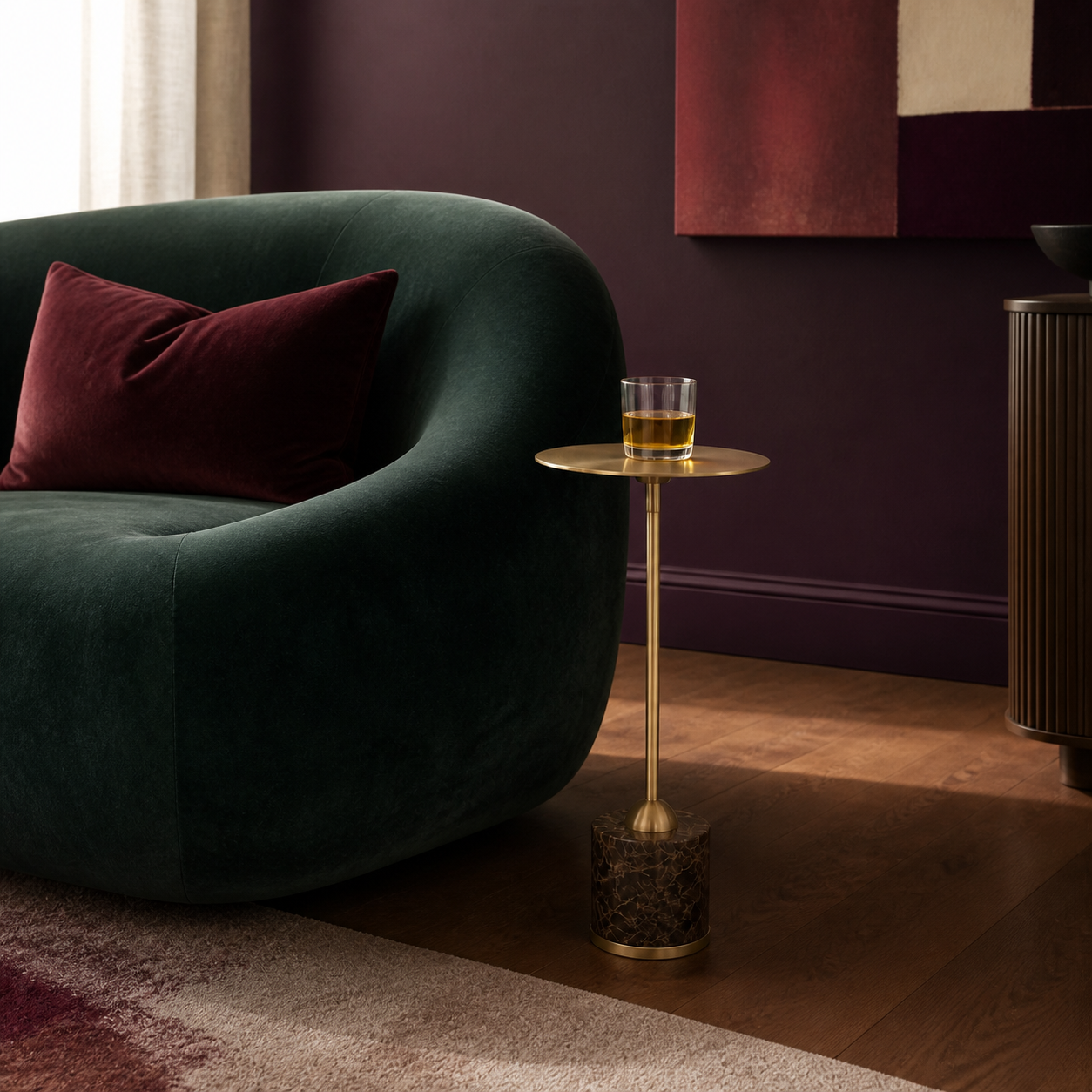 The Isabeau Drink Table beside emerald seating in a plum-toned interior