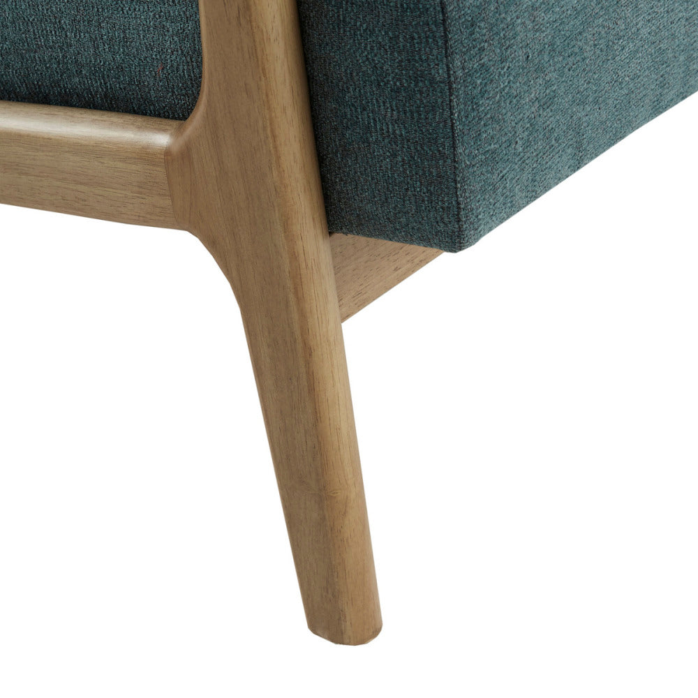 Macro close-up view of the Matheo lounge chair's base structure, displaying the smooth grain patterns and precise carpentry joins of the solid rubberwood leg.