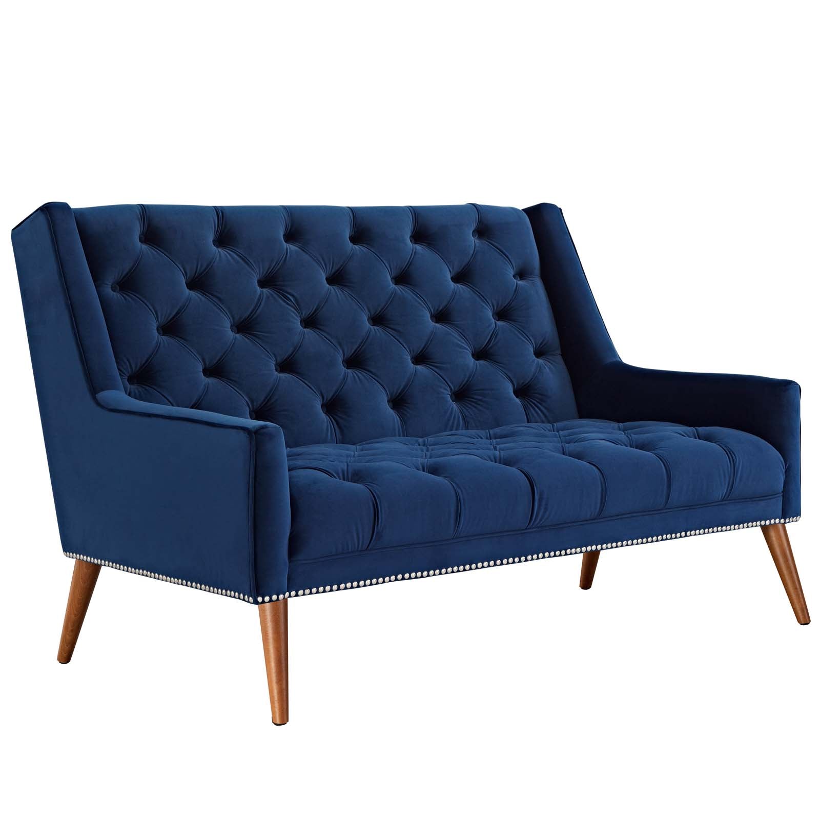 Low three-quarter studio perspective of the Peruse velvet loveseat in navy blue, emphasizing the depth of the tufted backrest profile and sloped arm track geometry.