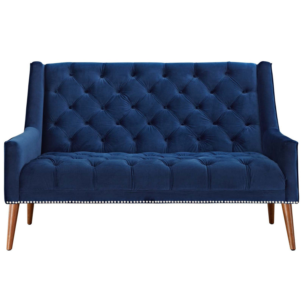 Symmetrical straight-on studio shot of the Peruse navy blue velvet loveseat, highlighting the uniform button tufting on the seat cushion and the lower row of antique nickel nailhead trim.